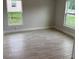 An empty living room with tile flooring and plenty of natural light at 71 Nw 42Nd Pl, Ocala, FL 34475