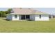 A spacious backyard with an expansive lawn, perfect for outdoor activities and relaxation at 8214 Nw 17Th Cir, Ocala, FL 34475