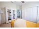 Bright bedroom with closet, neutral carpet, and armoire plus accent lighting and decor at 8214 Nw 17Th Cir, Ocala, FL 34475