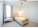 Bright bedroom with a charming bed frame, neutral carpet, and window with natural lighting at 8214 Nw 17Th Cir, Ocala, FL 34475
