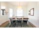 Light-filled dining room featuring a table set, pendant lighting, and decor at 8214 Nw 17Th Cir, Ocala, FL 34475