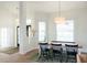Bright dining room with a rustic table set, decorative rug, and natural light at 8214 Nw 17Th Cir, Ocala, FL 34475