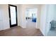 Entryway with a view of an open-concept living space and backyard with bright natural lighting at 8214 Nw 17Th Cir, Ocala, FL 34475