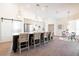 Open kitchen featuring an island with bar stool seating and stylish pendant lighting at 8214 Nw 17Th Cir, Ocala, FL 34475