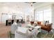 Bright living room features a stylish kitchen island, sleek furnishings, and plenty of natural light at 8214 Nw 17Th Cir, Ocala, FL 34475