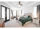 Well-lit main bedroom featuring a trey ceiling, and ensuite bathroom with a serene and inviting atmosphere at 8214 Nw 17Th Cir, Ocala, FL 34475