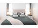 Well-lit main bedroom with decorative pillows and bedside tables with lamps at 8214 Nw 17Th Cir, Ocala, FL 34475