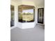 View of the patio that features a large bay window with an outdoor view and access to the backyard at 8214 Nw 17Th Cir, Ocala, FL 34475
