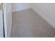 Spacious walk-in closet with neutral carpeting and ample space for storage at 8214 Nw 17Th Cir, Ocala, FL 34475
