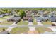 Aerial view of a neighborhood showcasing the well-maintained homes, yards, and community layout at 8216 Sw 60Th Ter, Ocala, FL 34476
