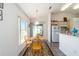 Cozy breakfast nook with table and chairs near the kitchen and backyard access at 8216 Sw 60Th Ter, Ocala, FL 34476