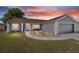 Inviting home exterior with manicured landscaping, walkway, and a two-car garage at 8216 Sw 60Th Ter, Ocala, FL 34476