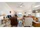 Spacious living room with vaulted ceilings, comfortable seating, and carpet flooring at 8216 Sw 60Th Ter, Ocala, FL 34476