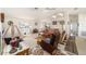 Open-concept living room featuring vaulted ceilings, a ceiling fan, and ample natural light at 8216 Sw 60Th Ter, Ocala, FL 34476