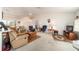 Spacious living area with vaulted ceilings, plush furniture, and access to the dining area at 8216 Sw 60Th Ter, Ocala, FL 34476