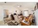 Comfortable living room with vaulted ceilings, plush seating, and large windows at 8216 Sw 60Th Ter, Ocala, FL 34476