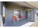 Comfortable covered patio with seating and view to backyard at 8216 Sw 60Th Ter, Ocala, FL 34476