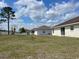 Backyard view showcasing multiple homes and large, open outdoor space at 8386 Sw 136Th Pl, Ocala, FL 34473