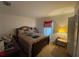 Cozy bedroom with a comfortable bed, soft lighting, and a window, creating a relaxing atmosphere at 8386 Sw 136Th Pl, Ocala, FL 34473
