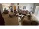 Open-concept living room with sofas, chaise lounge, and dining area at 8386 Sw 136Th Pl, Ocala, FL 34473