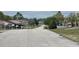 A neighborhood street with well-maintained homes and manicured lawns provides a serene living environment at 8386 Sw 136Th Pl, Ocala, FL 34473