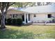 The home features a neatly kept backyard and sunroom at 8569 Sw 92Nd Ln # B, Ocala, FL 34481