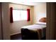 Bedroom with a double bed and large window at 8569 Sw 92Nd Ln # B, Ocala, FL 34481