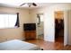 Bedroom with hardwood floors showing access to the walk-in closet and bathroom at 8569 Sw 92Nd Ln # B, Ocala, FL 34481