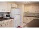 An efficient kitchen featuring white appliances and ample cabinet space at 8569 Sw 92Nd Ln # B, Ocala, FL 34481