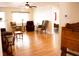 Cozy living room with hardwood floors, comfortable seating, and a view to the bedroom at 8569 Sw 92Nd Ln # B, Ocala, FL 34481