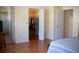 Main bedroom with hardwood floors, large closets, and ensuite bathroom at 8569 Sw 92Nd Ln # B, Ocala, FL 34481