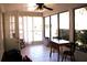 Sunroom with tile floor, ceiling fan, large windows, and furniture at 8569 Sw 92Nd Ln # B, Ocala, FL 34481
