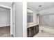 Bathroom with gray tile, granite vanity, and shower-tub combo at 8836 Sw 90Th Ln # B, Ocala, FL 34481