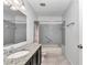 Bright bathroom features gray tiled shower-tub combo and granite vanity at 8836 Sw 90Th Ln # B, Ocala, FL 34481