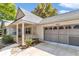 Well-maintained home featuring a covered porch, brick facade, and convenient driveway at 8836 Sw 90Th Ln # B, Ocala, FL 34481