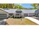 Charming single-story home featuring well-kept landscaping, a gray roof and a welcoming entrance at 8836 Sw 90Th Ln # B, Ocala, FL 34481