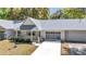 Charming single-story home featuring well-kept landscaping, a gray roof and a welcoming entrance at 8836 Sw 90Th Ln # B, Ocala, FL 34481