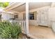 Charming front porch adorned with white columns leads to the main entrance of the home at 8836 Sw 90Th Ln # B, Ocala, FL 34481