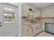 Charming kitchen with updated cabinets, stainless steel appliances, and a view to the backyard at 8836 Sw 90Th Ln # B, Ocala, FL 34481