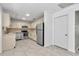 Spacious kitchen boasts stainless steel appliances, tile floor and ample cabinet space at 8836 Sw 90Th Ln # B, Ocala, FL 34481