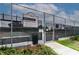 Community pickleball courts behind a chain-link fence with a sign displaying rules and court information at 8836 Sw 90Th Ln # B, Ocala, FL 34481