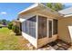 Enclosed porch with screen windows offers an inviting space for relaxation and enjoying the outdoors at 8836 Sw 90Th Ln # B, Ocala, FL 34481