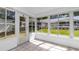 This sunroom with many windows allows for great light, overlooking the backyard at 8836 Sw 90Th Ln # B, Ocala, FL 34481