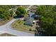 Aerial view of a home showing the roof and surrounding green space and street access at 9300 Se 161St St, Summerfield, FL 34491