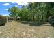 Grassy backyard and mature trees at 9300 Se 161St St, Summerfield, FL 34491