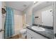 Bathroom with a shower and tub combination and a large mirror above the vanity at 9300 Se 161St St, Summerfield, FL 34491