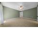 Large bedroom features tile flooring, and ample natural light, and a calming color palette at 9300 Se 161St St, Summerfield, FL 34491