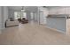 Inviting living room and kitchen space with neutral tones, tile flooring, and ample natural light at 9300 Se 161St St, Summerfield, FL 34491