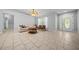 Comfortable living room with neutral paint, tile floors, and large windows for a bright and spacious feel at 9300 Se 161St St, Summerfield, FL 34491