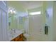 Bathroom with a tub and shower and traditional sink at 9509 Se 124Th Loop, Summerfield, FL 34491